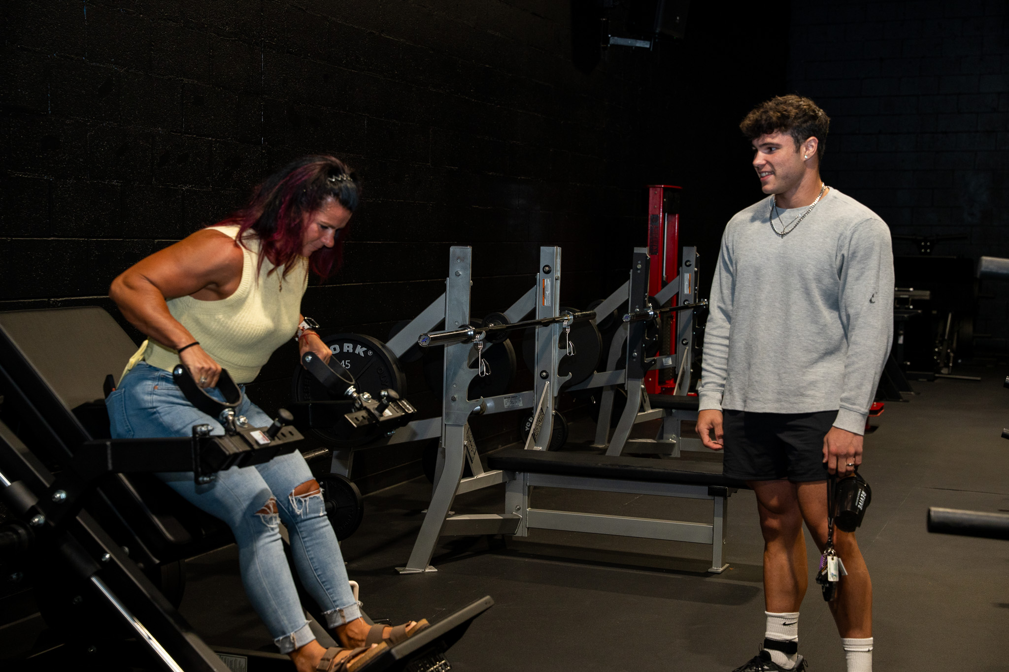 A mom and son lifting together at the REVIVE grand opening